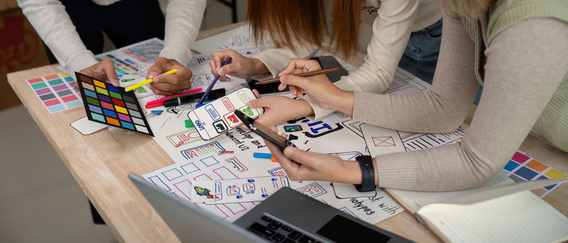 Brainstorm team of creative web graphic designer planning, Group of mobile phone app developer team meeting for share ideas about screen prototype layout for smartphone. startup planning ui and ux